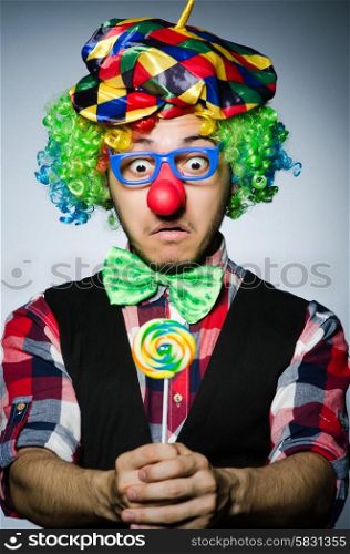 Funny clown with sweet lollipop