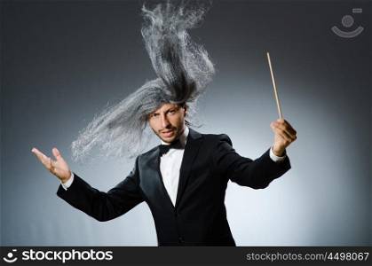 Funny conductor with long grey hair