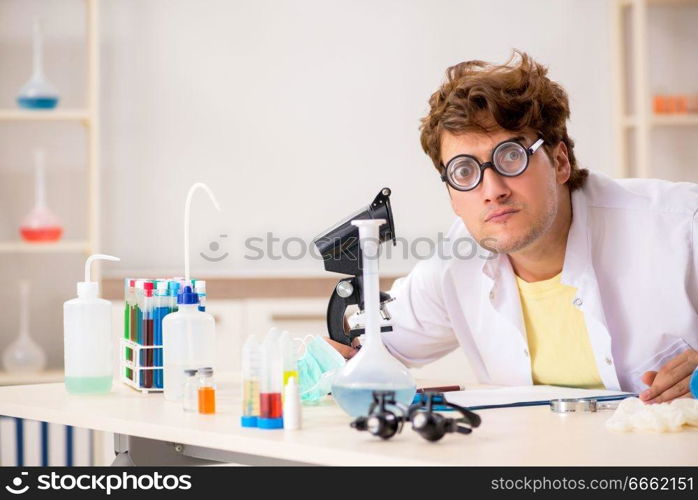 Funny crazy chemist doing experiments and tests