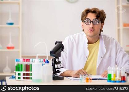 Funny crazy chemist doing experiments and tests