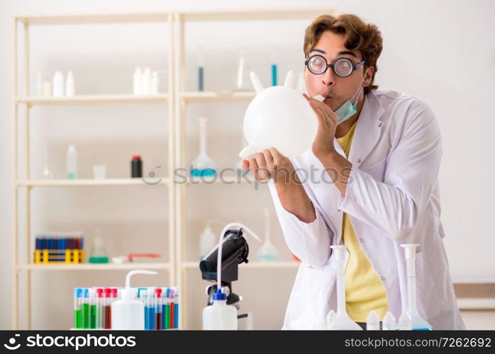 Funny crazy chemist doing experiments and tests. The funny crazy chemist doing experiments and tests