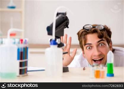 Funny crazy chemist doing experiments and tests. The funny crazy chemist doing experiments and tests