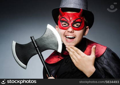 Funny devil against dark background