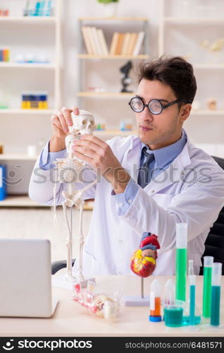 Funny doctor having fun in hospital lab