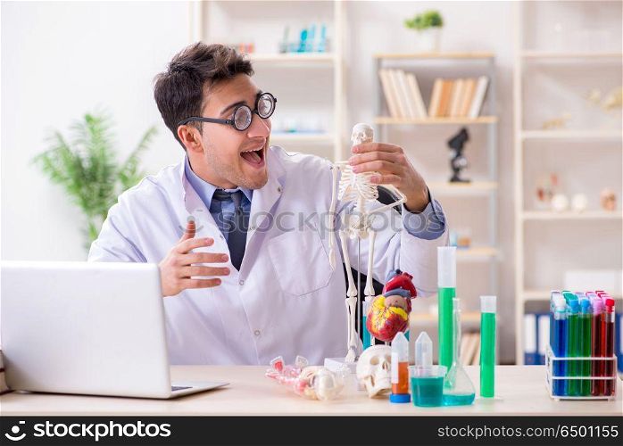 Funny doctor having fun in hospital lab
