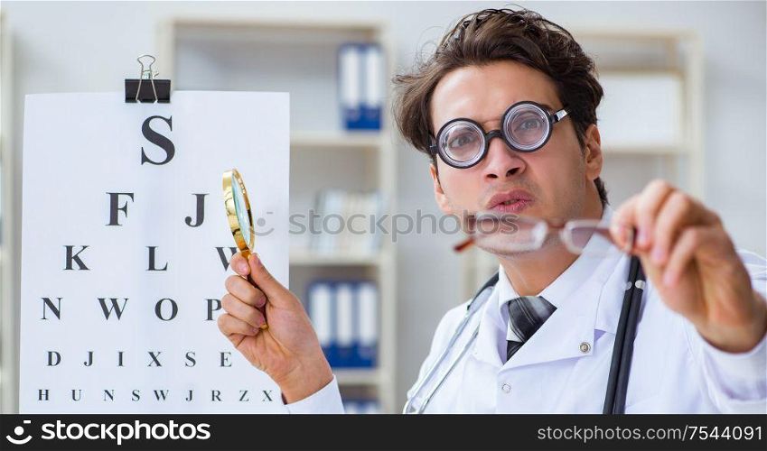Funny eye doctor in humourous medical concept. The funny eye doctor in humourous medical concept