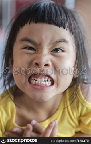 funny face of asian children grin ,toothy face