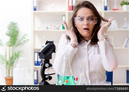 Funny female chemist working in the lab 