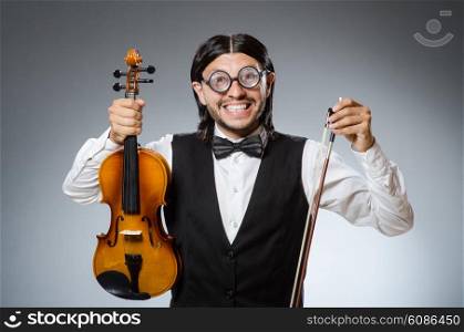 Funny fiddle violin player in musical concept