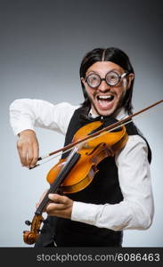 Funny fiddle violin player in musical concept