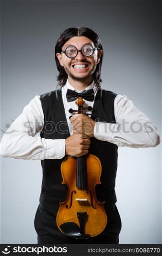 Funny fiddle violin player in musical concept