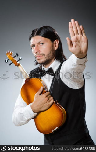 Funny fiddle violin player in musical concept