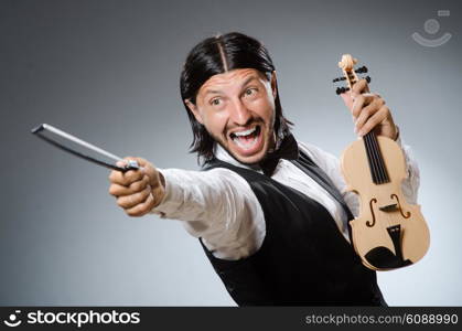 Funny fiddle violin player in musical concept