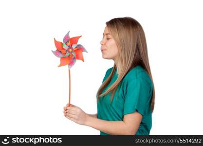 Funny girl blowing a pinwheel isolated on white background