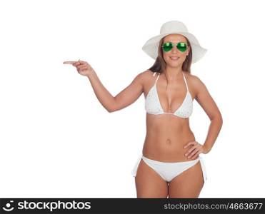 Funny girl in bikini indicating at side isolated on a white background