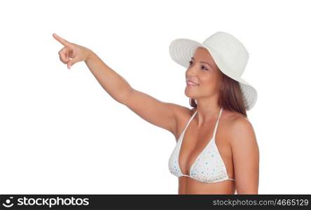 Funny girl in bikini indicating something isolated on a white background
