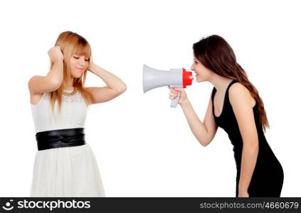 Funny girl with a megaphone talking to her friend isolated on a white background