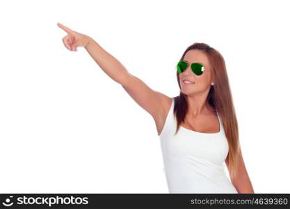 Funny girl with sunglasses indicating at side isolated on a white background