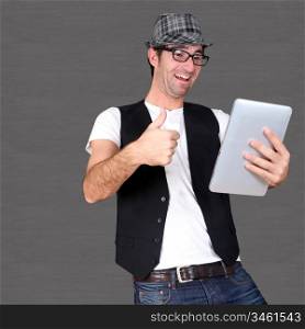 Funny guy using electronic tablet