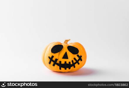 Funny Halloween day party concept ghost pumpkin head jack lantern scary smile, studio shot isolated on white background, Holiday decoration