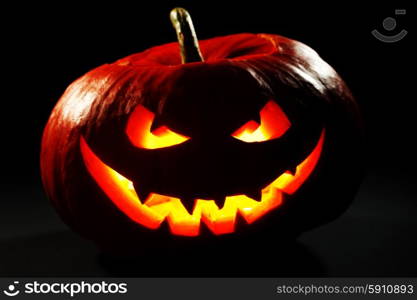 Funny Halloween Jack O&amp;#39; Lantern pumpkin on black background