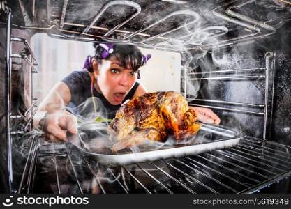 Funny Housewife overlooked roast chicken in the oven, so she had scorched (focus on chicken), view from the inside of the oven. Housewife perplexed and angry. Loser is destiny!