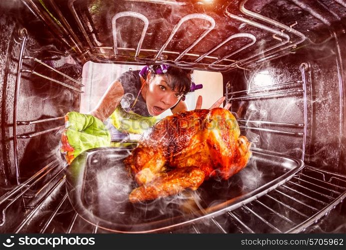 Funny Housewife overlooked roast chicken in the oven, so she had scorched , view from the inside of the oven. Housewife perplexed and angry. Loser is destiny!