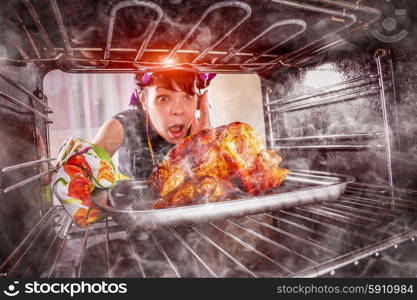 Funny Housewife overlooked roast chicken in the oven, so she had scorched (focus on chicken), view from the inside of the oven. Housewife perplexed and angry. Loser is destiny! Thanksgiving Day.