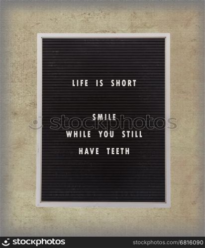 Funny, inspirational quotation about life on a very old menu board, vintage background