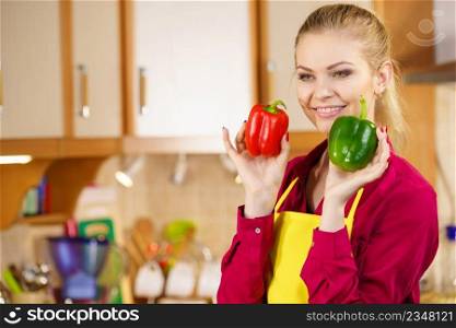 Funny joyful woman holding bell pepper delicious healthy dieting vegetable presenting diet food.. Happy woman holding bell peppers paprika