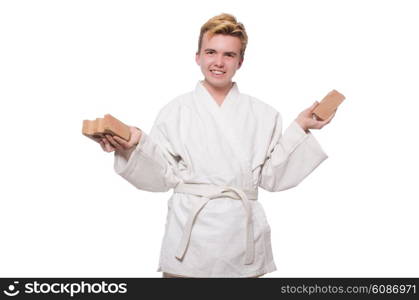 Funny karate man breaking bricks isolated on white