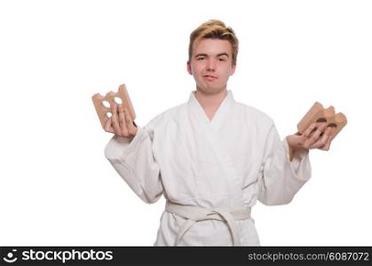 Funny karate man breaking bricks isolated on white