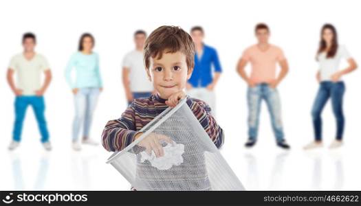 Funny kid throwing a role in the bin with young people of background unfocused