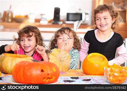 Funny Kids carving pumpkins