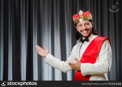 Funny king wearing crown in coronation concept