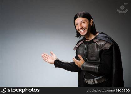 Funny knight against dark background