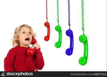Funny little child talking on the phone and others colorful phones hunging isolated on a white background