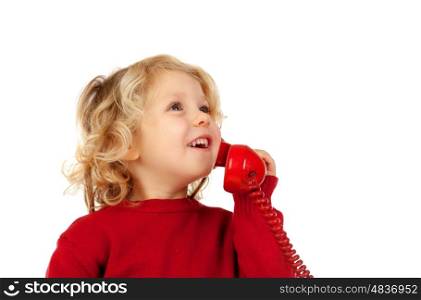 Funny little child talking on the phone isolated on a white background