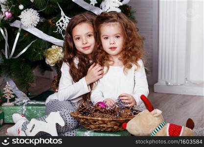 Funny little girl wearing eyeglasses imitates a strict teacher against white background.  Little student Looking at camera.  School concept.  Back to School