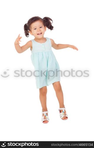 Funny little girl with pigtails jumping isolated on a white background