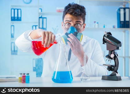 Funny mad chemist working in a laboratory