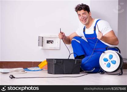 Funny Man doing electrical repairs at home