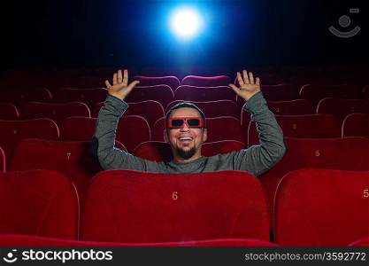 Funny man in 3D glasses watching movie in cinema