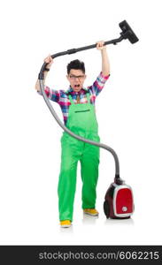 Funny man in green coveralls vacuum cleaning