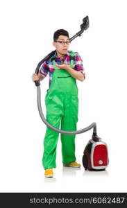 Funny man in green coveralls vacuum cleaning