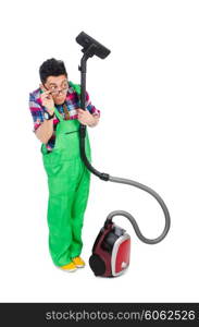 Funny man in green coveralls vacuum cleaning