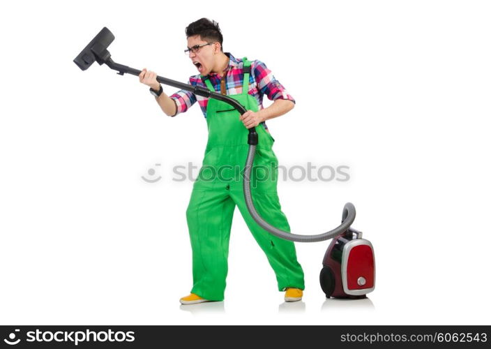 Funny man in green coveralls vacuum cleaning