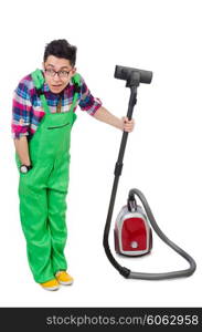 Funny man in green coveralls vacuum cleaning