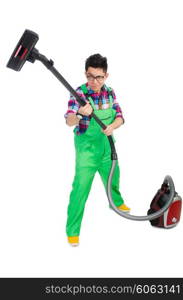 Funny man in green coveralls vacuum cleaning