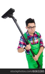 Funny man in green coveralls vacuum cleaning